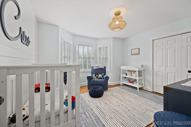 bedroom featuring a closet and wood-type flooring