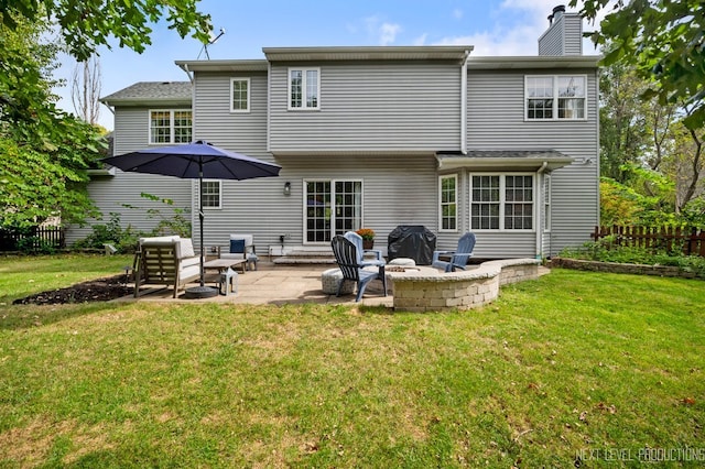 back of property featuring a lawn and a patio area