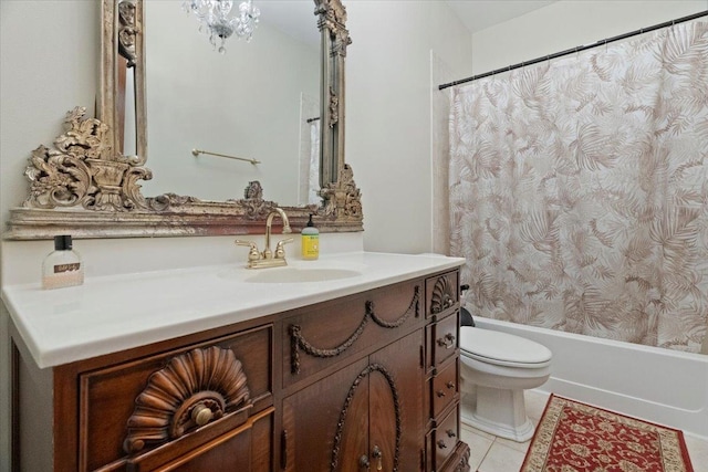 bathroom with tile patterned floors, vanity, and toilet