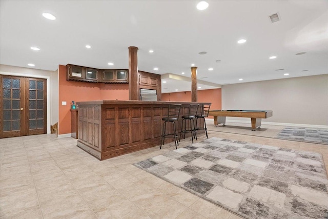 bar featuring stainless steel fridge, french doors, and pool table