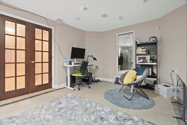 office space with tile patterned floors and french doors