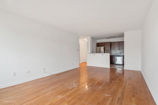 unfurnished living room with light hardwood / wood-style floors