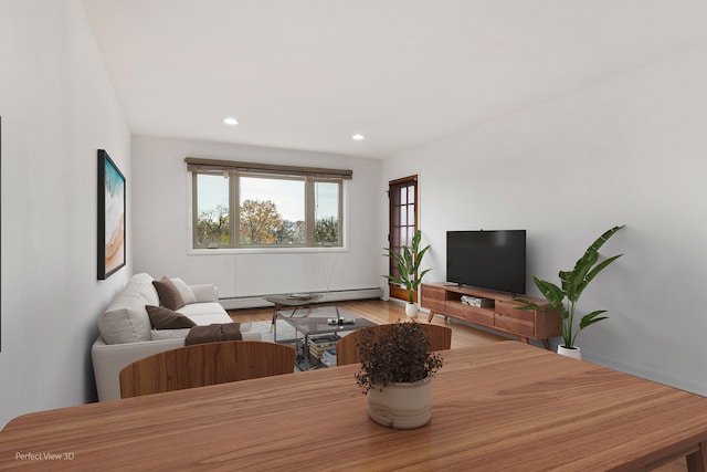 living room featuring wood-type flooring and a baseboard radiator