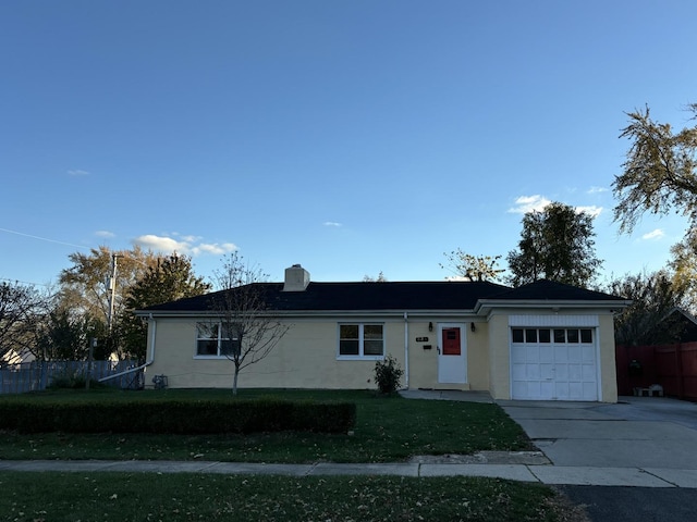 single story home with a garage and a front yard