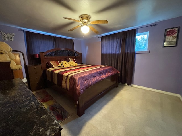 bedroom featuring light carpet and ceiling fan