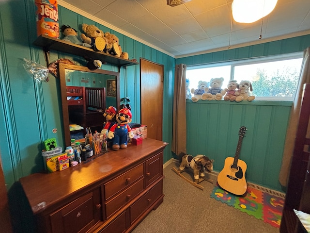 recreation room featuring carpet flooring and ornamental molding