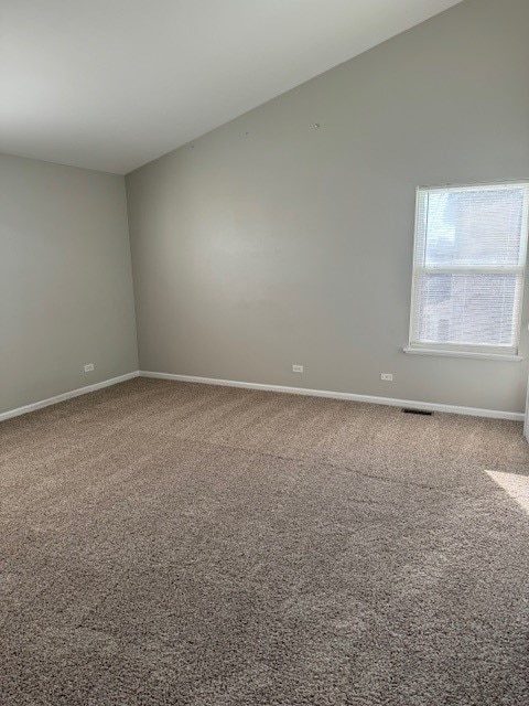 spare room featuring carpet