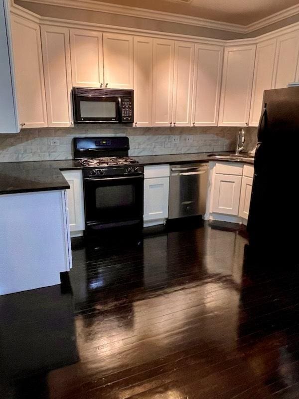 kitchen with black appliances, dark hardwood / wood-style flooring, and white cabinetry