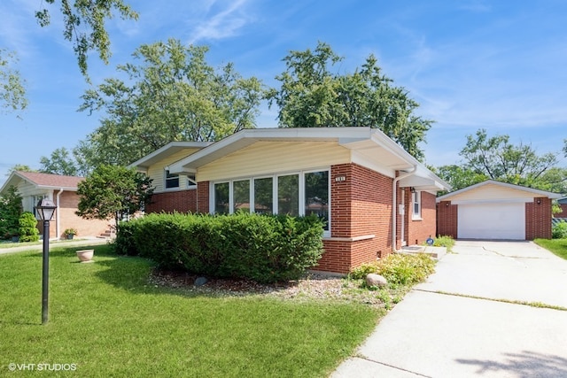 view of front of property with an outbuilding, a front lawn, and a garage