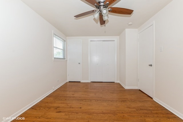 unfurnished bedroom with light wood-type flooring and ceiling fan