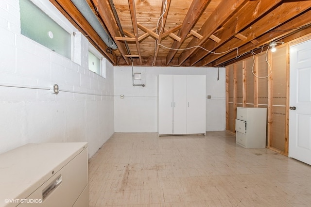 basement featuring refrigerator