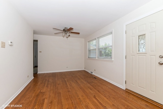 foyer featuring ceiling fan and wood-type flooring