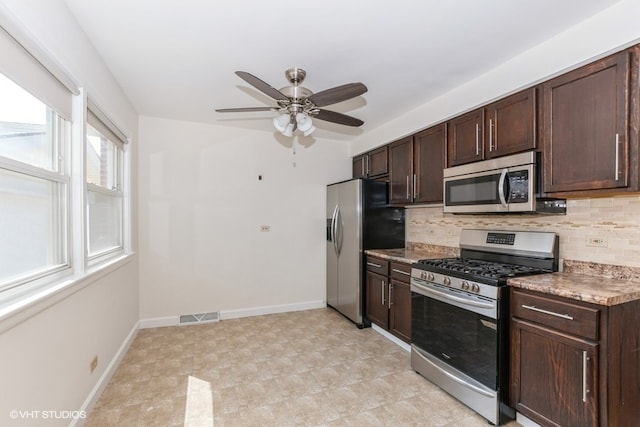 kitchen featuring decorative backsplash, dark brown cabinets, ceiling fan, and appliances with stainless steel finishes