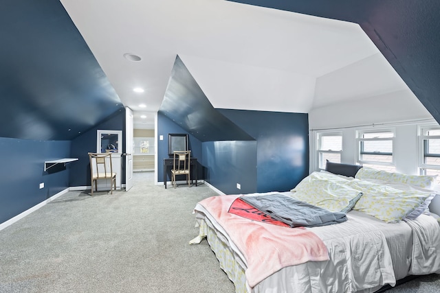 bedroom featuring carpet flooring and lofted ceiling