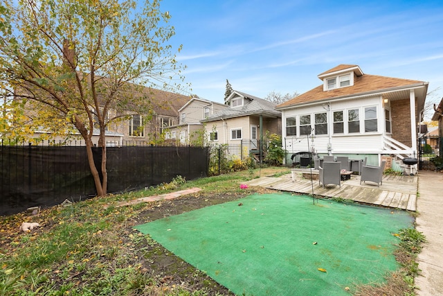 rear view of house featuring a deck