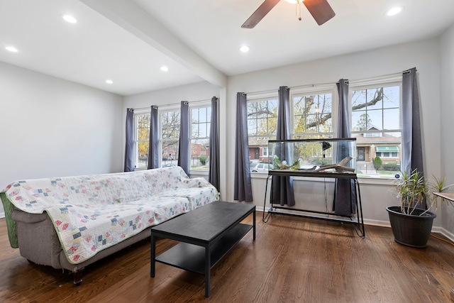 living room featuring dark hardwood / wood-style floors and ceiling fan