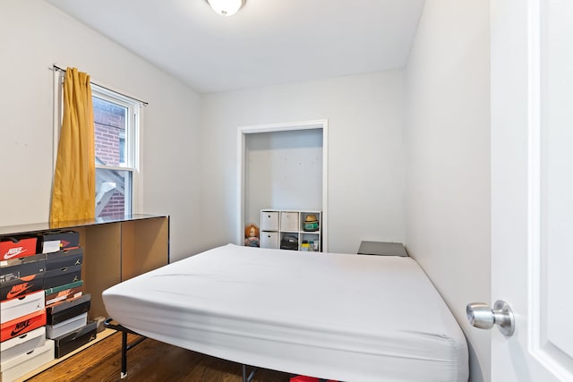 bedroom with wood-type flooring