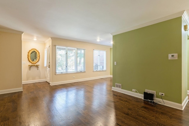 unfurnished living room with dark wood-style floors, ornamental molding, visible vents, and baseboards