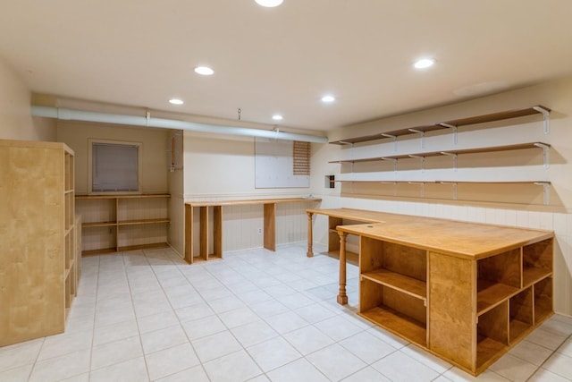 finished basement with light tile patterned flooring and recessed lighting