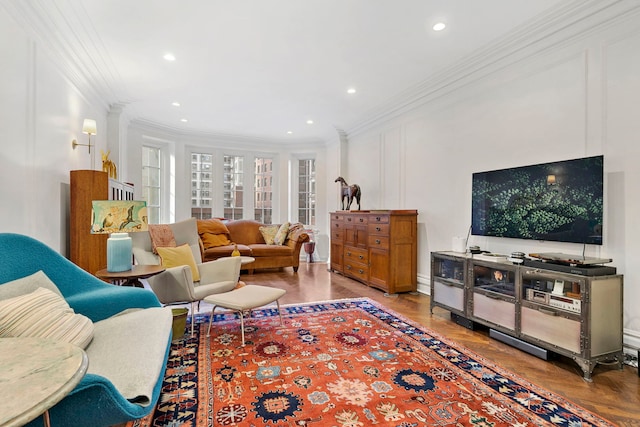 living room featuring crown molding and hardwood / wood-style floors