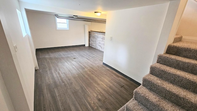 basement featuring dark hardwood / wood-style floors