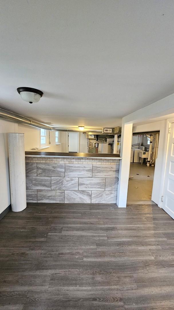 kitchen with dark wood-type flooring