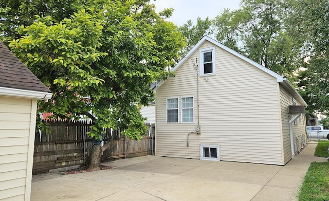 view of side of property featuring a patio