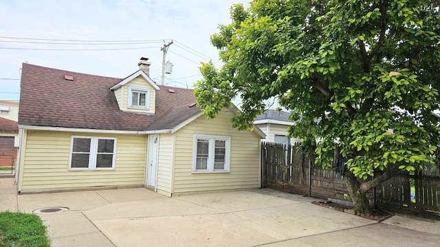 back of house with a patio