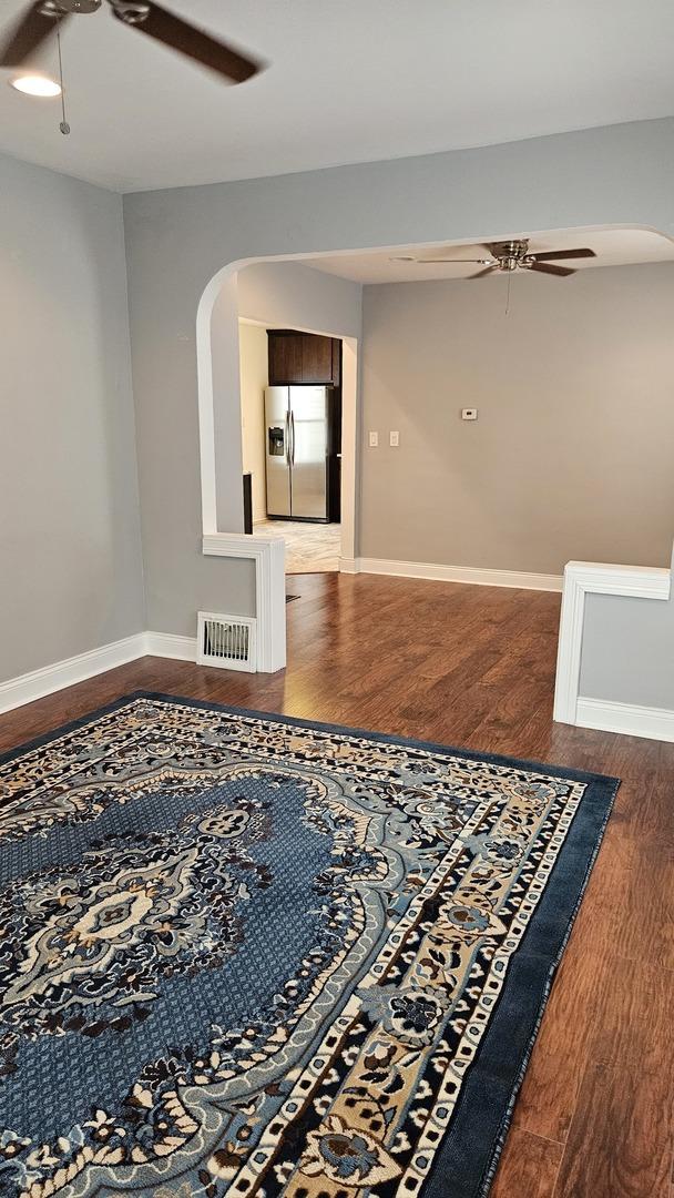 unfurnished room featuring wood-type flooring and ceiling fan