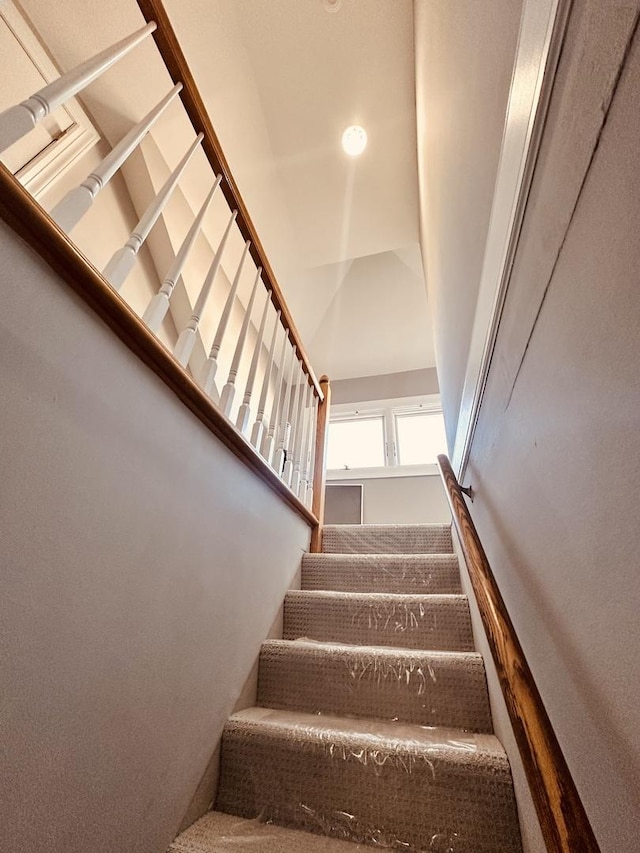 stairway with a towering ceiling