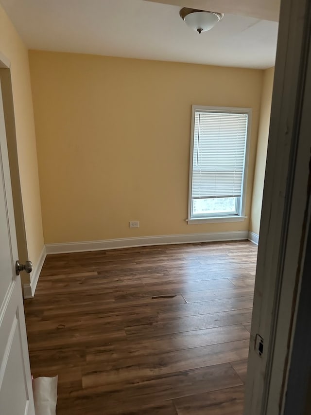 empty room featuring dark hardwood / wood-style floors