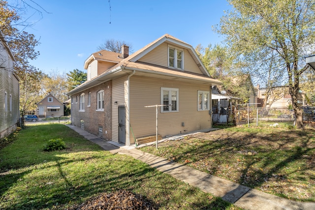 back of house with a yard