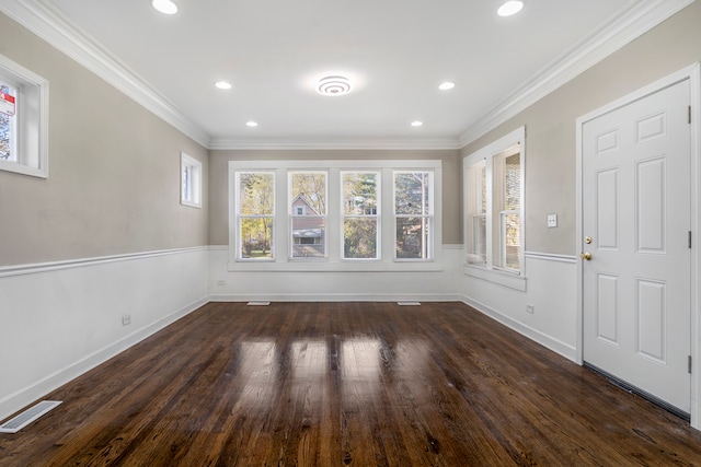 interior space featuring crown molding and dark wood-type flooring