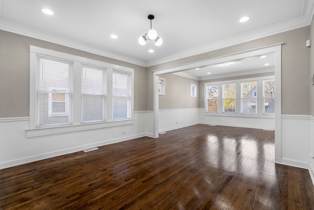 interior space with ornamental molding, dark hardwood / wood-style flooring, and an inviting chandelier