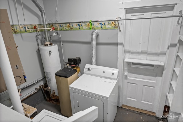 laundry area featuring water heater and washer / dryer