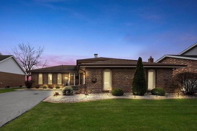 view of front of home with a lawn