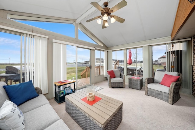 sunroom / solarium featuring vaulted ceiling with beams and ceiling fan