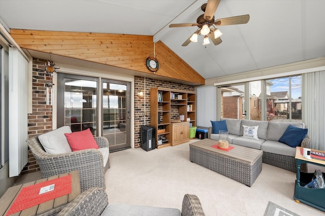 carpeted living room with vaulted ceiling with beams and ceiling fan