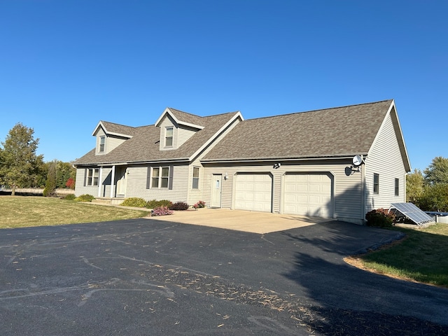 new england style home featuring a garage