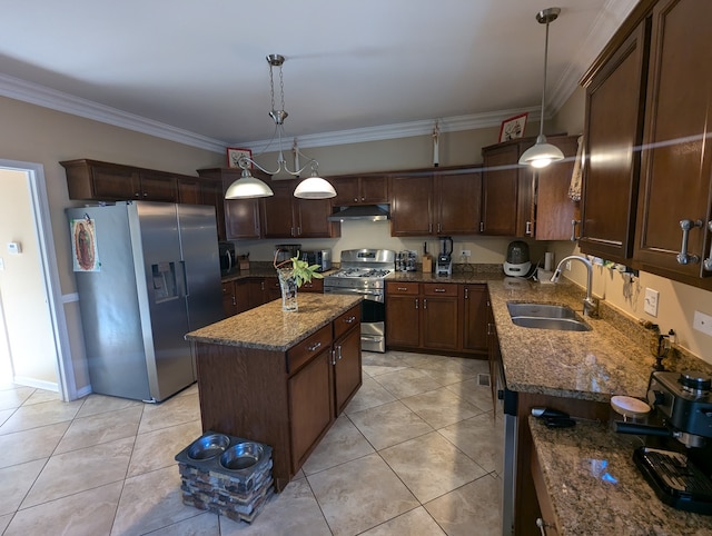 kitchen featuring hanging light fixtures, a center island, appliances with stainless steel finishes, and sink