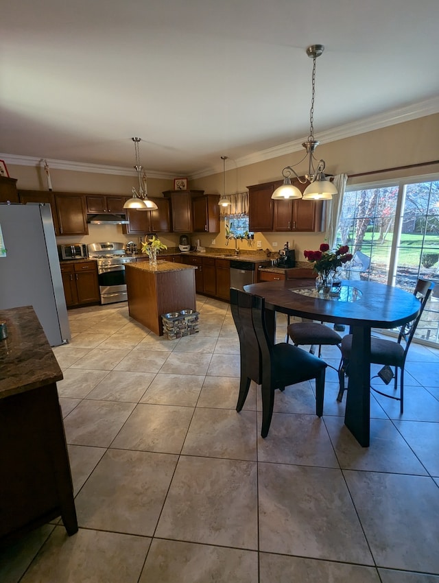 tiled dining room with crown molding