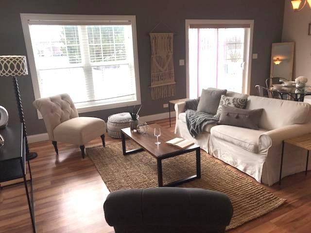 living room with wood finished floors and baseboards
