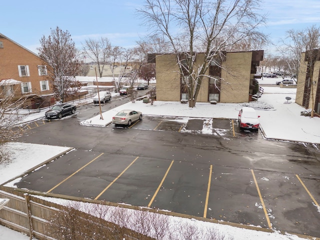 view of snow covered parking