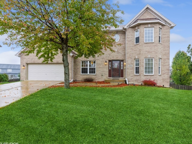 view of front of house with a front yard and a garage