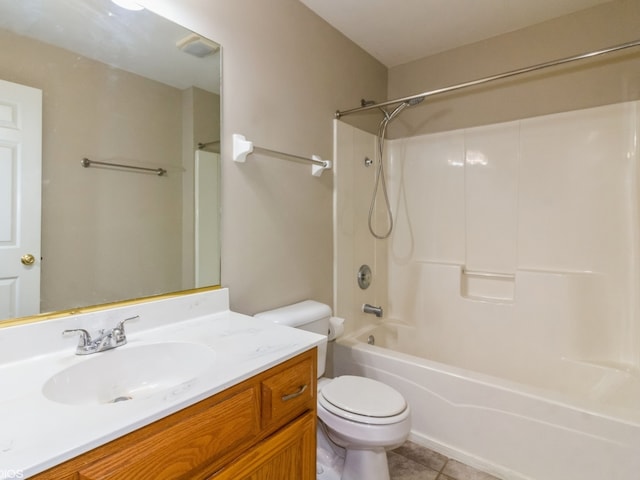 full bathroom with toilet, vanity, tile patterned floors, and washtub / shower combination