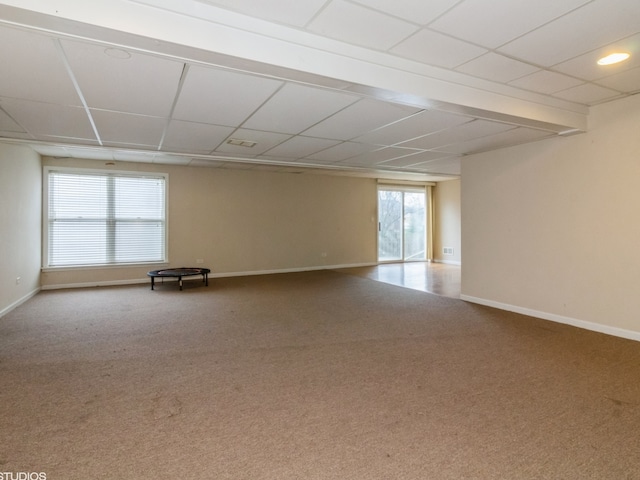 carpeted empty room featuring a wealth of natural light