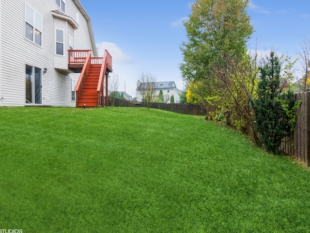 view of yard featuring a wooden deck