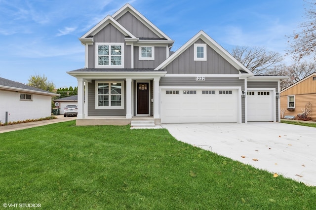 craftsman-style house featuring a front lawn and a garage