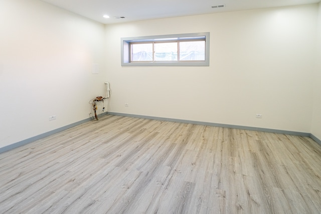 spare room featuring light wood-type flooring