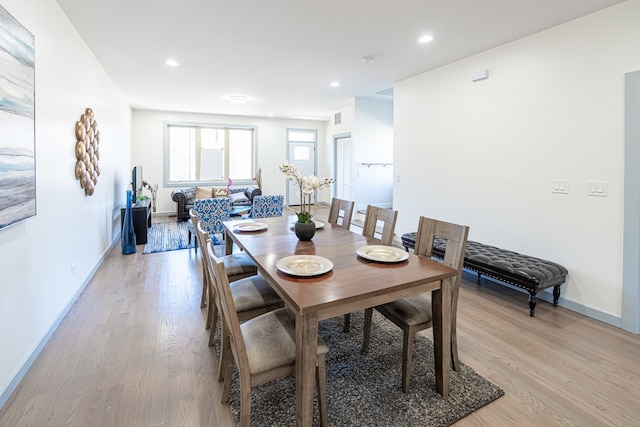 dining area with light hardwood / wood-style flooring